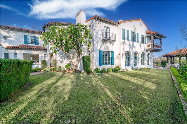 1812 Linda Vista Ave, Pasadena, CA 91103 - mediterranean / spanish home with a balcony, a chimney, stucco siding, a gazebo, and a front lawn