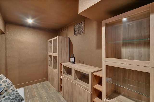 1812 Linda Vista Ave, Pasadena, CA 91103 - wine room with wood finished floors and a textured wall