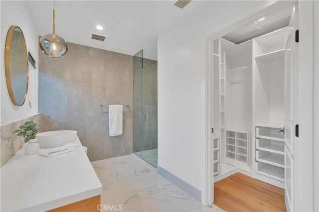 1812 Linda Vista Ave, Pasadena, CA 91103 - full bath featuring a walk in closet, a shower stall, vanity, marble finish flooring, and recessed lighting
