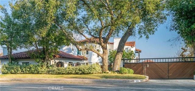 1812 Linda Vista Ave, Pasadena, CA 91103 - view of front of house with a tile roof, stucco siding, and a chimney