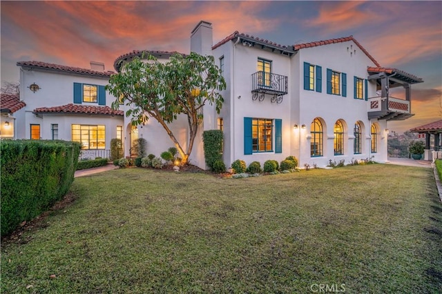 1812 Linda Vista Ave, Pasadena, CA 91103 - mediterranean / spanish home with a balcony, stucco siding, a tiled roof, a front lawn, and a chimney