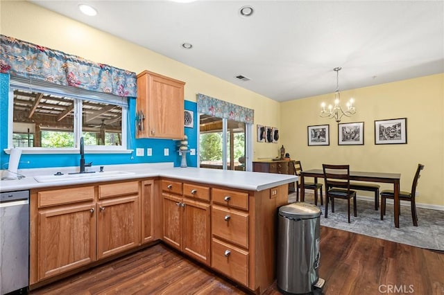 4930 Contentment Ln, Forest Ranch, CA 95942 - kitchen featuring a sink, a chandelier, stainless steel dishwasher, dark wood-type flooring, and a peninsula