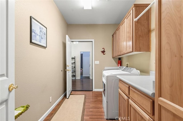 4930 Contentment Ln, Forest Ranch, CA 95942 - laundry room with cabinet space, wood finished floors, independent washer and dryer, and baseboards