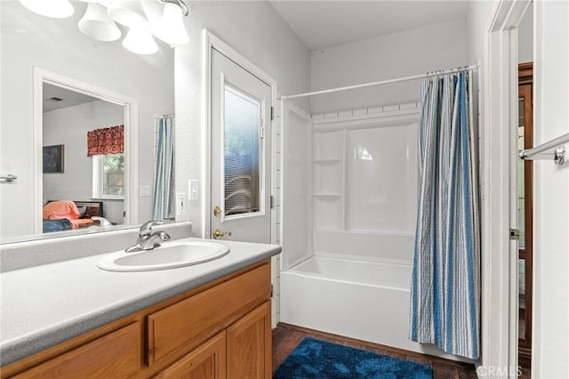 4930 Contentment Ln, Forest Ranch, CA 95942 - ensuite bathroom featuring shower / tub combo with curtain, vanity, and wood finished floors