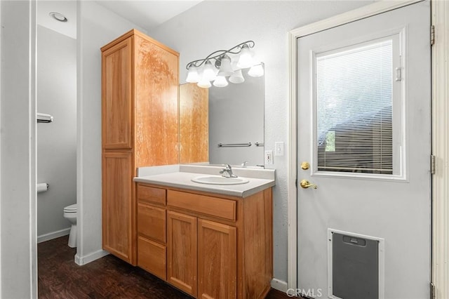 4930 Contentment Ln, Forest Ranch, CA 95942 - bathroom with vanity, toilet, wood finished floors, and baseboards