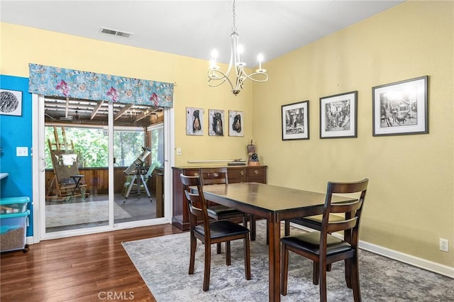 4930 Contentment Ln, Forest Ranch, CA 95942 - dining area with a chandelier, wood finished floors, and baseboards