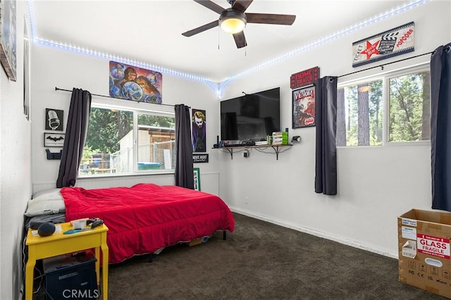 4930 Contentment Ln, Forest Ranch, CA 95942 - bedroom with multiple windows, carpet floors, baseboards, and ceiling fan