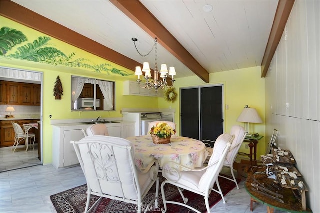 3935 Oakfield Dr, Sherman Oaks, CA 91423 - dining area featuring separate washer and dryer, beamed ceiling, and a chandelier