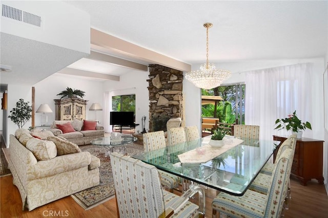 3935 Oakfield Dr, Sherman Oaks, CA 91423 - dining space with a chandelier, wood finished floors, and beam ceiling