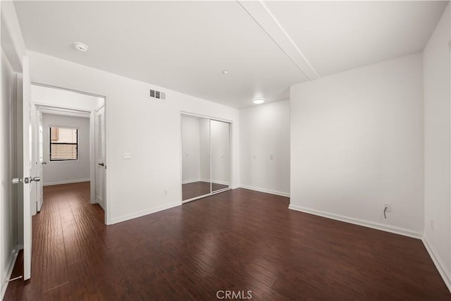 879 Michigan Blvd Unit B, Pasadena, CA 91107 - unfurnished bedroom featuring dark wood finished floors, a closet, and baseboards