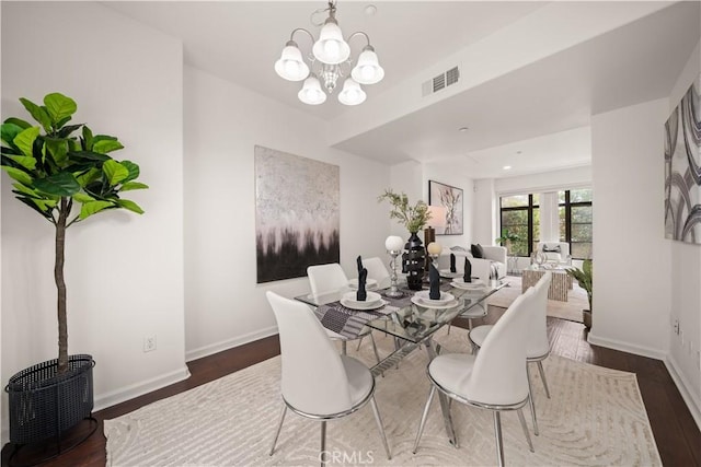 879 Michigan Blvd Unit B, Pasadena, CA 91107 - dining space featuring wood finished floors, baseboards, and a chandelier