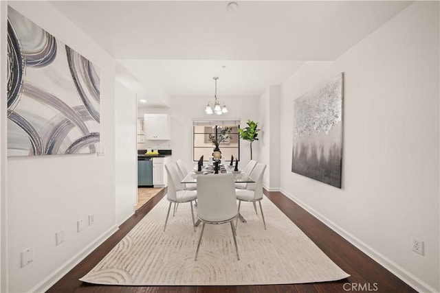 879 Michigan Blvd Unit B, Pasadena, CA 91107 - dining area featuring a chandelier, dark wood finished floors, and baseboards