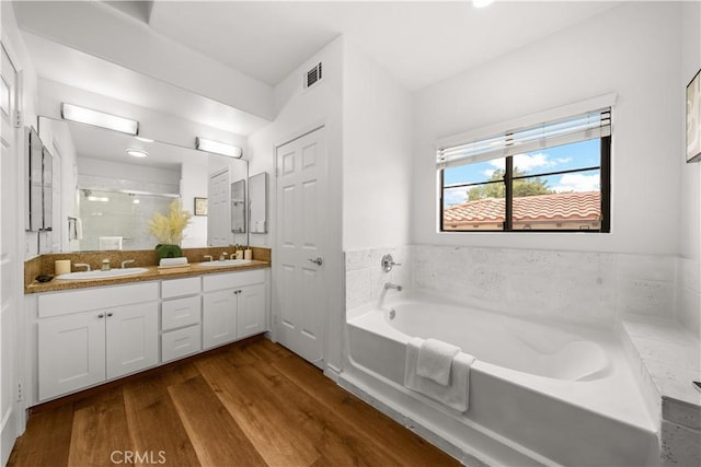 879 Michigan Blvd Unit B, Pasadena, CA 91107 - full bathroom with a garden tub, double vanity, a shower stall, and wood finished floors