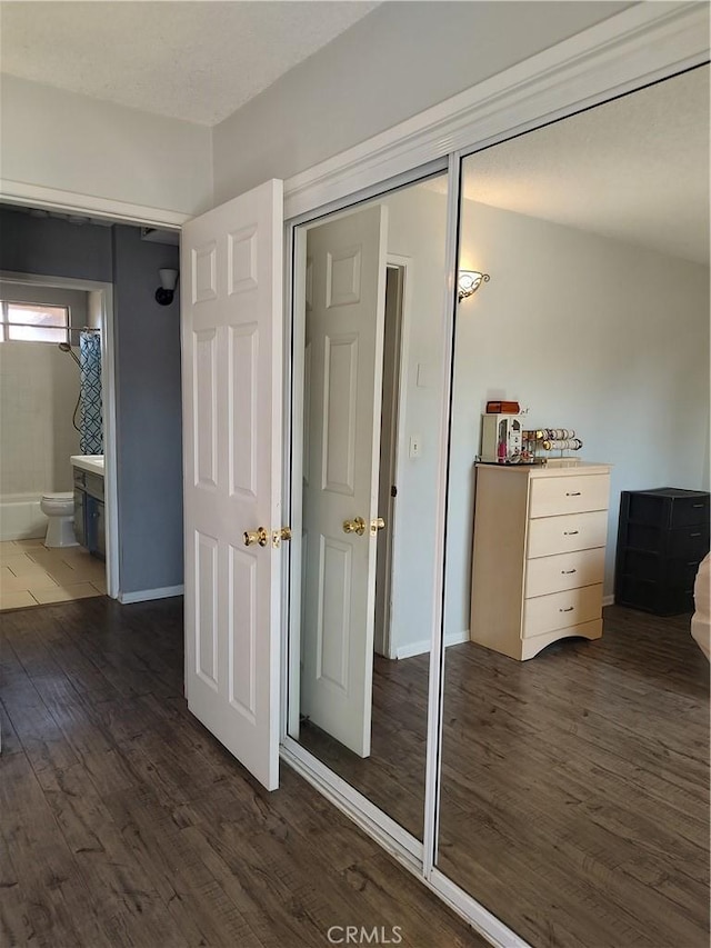 7870 Hopi Trl, Yucca Valley, CA 92284 - bedroom featuring wood finished floors and ensuite bathroom