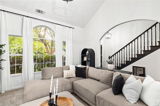 13 Noyo Ct, Chico, CA 95973 - carpeted living area featuring stairs and high vaulted ceiling