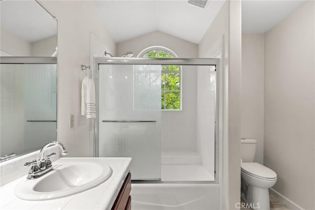 13 Noyo Ct, Chico, CA 95973 - bathroom with vanity, toilet, lofted ceiling, and bath / shower combo with glass door