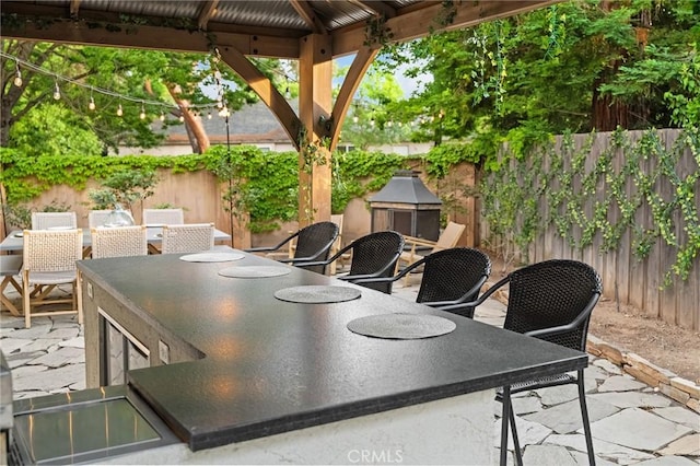 13 Noyo Ct, Chico, CA 95973 - fenced backyard featuring outdoor dining space, a patio area, and a gazebo