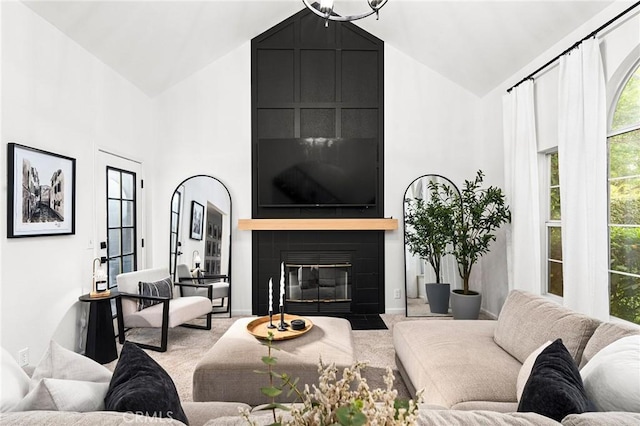 13 Noyo Ct, Chico, CA 95973 - living room with high vaulted ceiling, healthy amount of natural light, carpet, and a fireplace