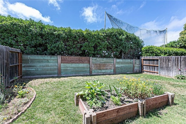 1168 E Foster Rd Unit B, Santa Maria, CA 93455 - fenced backyard with a vegetable garden