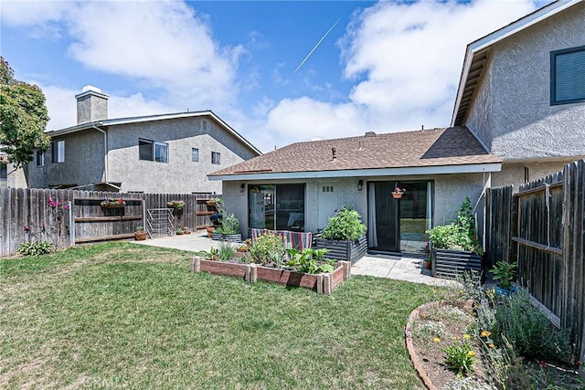 1168 E Foster Rd Unit B, Santa Maria, CA 93455 - back of house featuring a garden, stucco siding, a fenced backyard, and a patio area