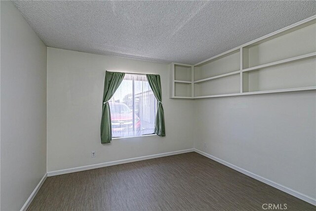 1168 E Foster Rd Unit B, Santa Maria, CA 93455 - empty room featuring a textured ceiling and baseboards