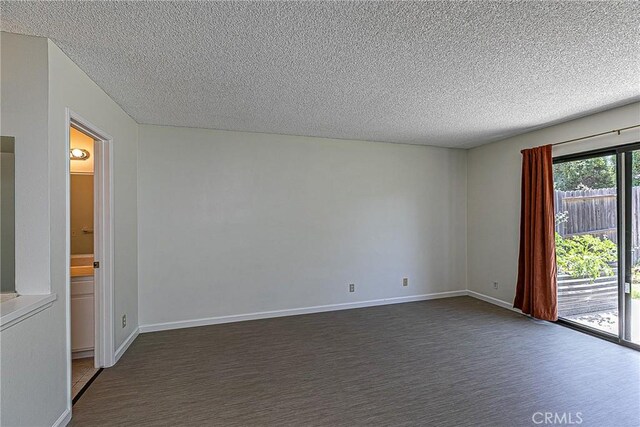 1168 E Foster Rd Unit B, Santa Maria, CA 93455 - spare room featuring a textured ceiling and dark colored carpet