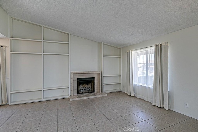 1168 E Foster Rd Unit B, Santa Maria, CA 93455 - unfurnished living room featuring a textured ceiling, built in features, tile patterned floors, a brick fireplace, and vaulted ceiling