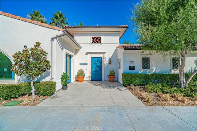 21836 Moveo Dr, Saugus, CA 91350 - mediterranean / spanish-style house with a tiled roof and stucco siding