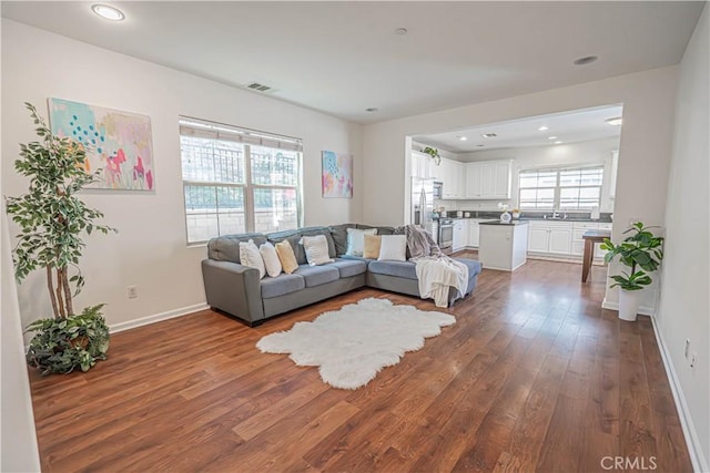 21836 Moveo Dr, Saugus, CA 91350 - living area featuring wood finished floors and recessed lighting