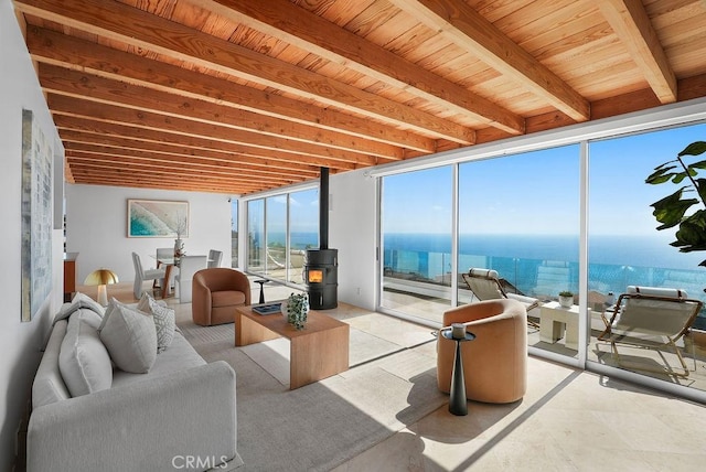 1119 Katella St, Laguna Beach, CA 92651 - sunroom / solarium with a wood stove, a water view, and beamed ceiling