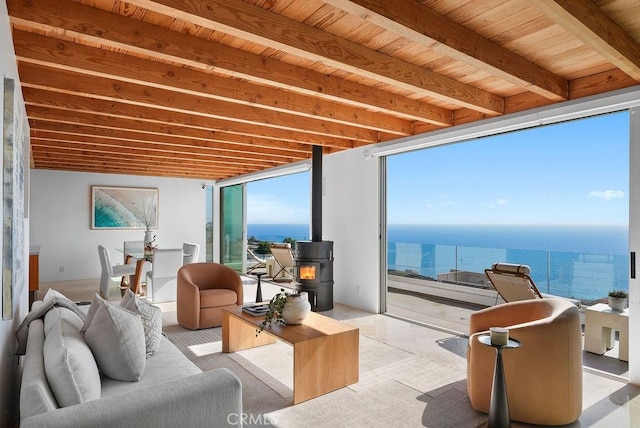 1119 Katella St, Laguna Beach, CA 92651 - living room featuring a wood stove, a water view, and wood ceiling with exposed beams