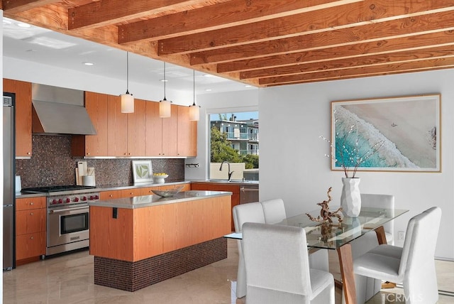 1119 Katella St, Laguna Beach, CA 92651 - kitchen featuring appliances with stainless steel finishes, wall chimney exhaust hood, tasteful backsplash, decorative light fixtures, and a sink