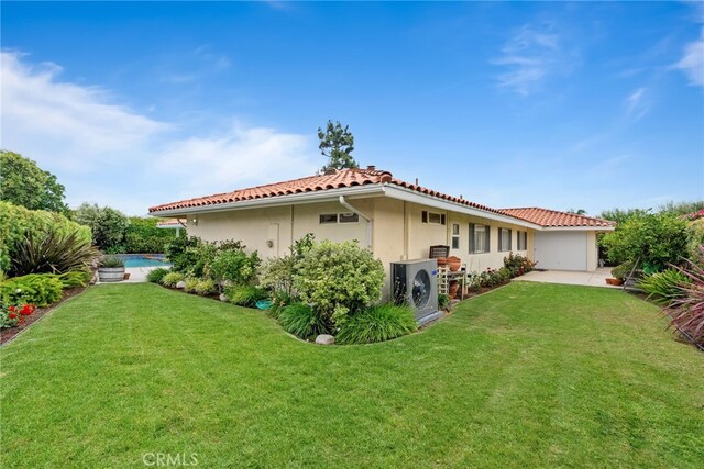 1162 Castlegate, North Tustin, CA 92705 - view of home's exterior featuring a tile roof, a lawn, stucco siding, a patio area, and ac unit
