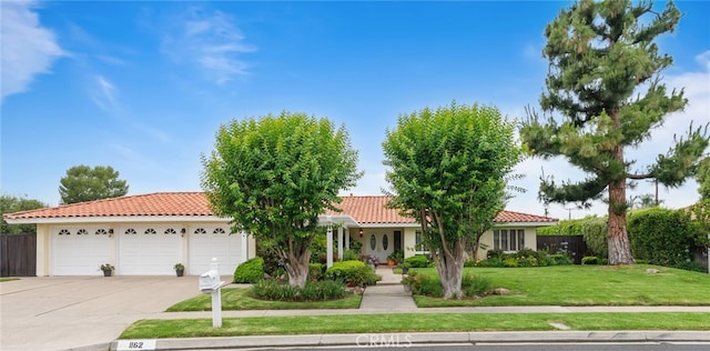 1162 Castlegate, North Tustin, CA 92705 - view of front of house featuring a tile roof, driveway, a garage, and stucco siding