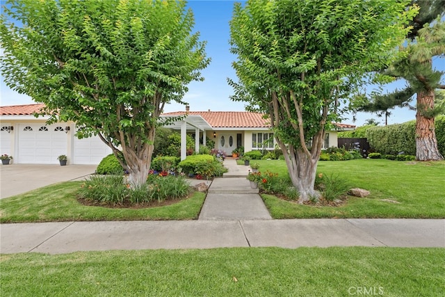 1162 Castlegate, North Tustin, CA 92705 - view of front of property with a tiled roof, stucco siding, a front lawn, and concrete driveway