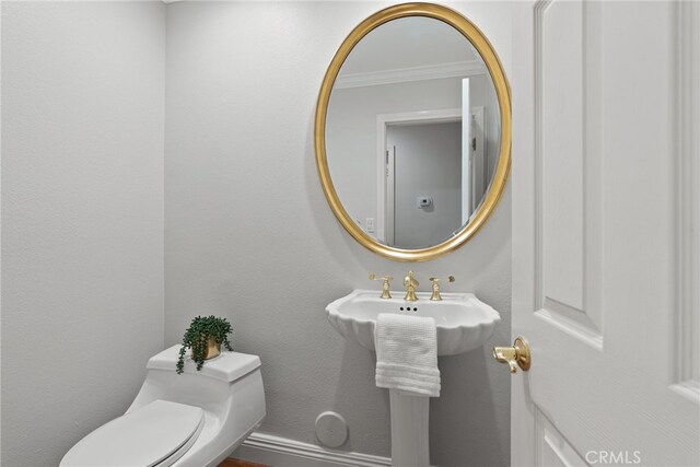 1162 Castlegate, North Tustin, CA 92705 - half bathroom with toilet and crown molding