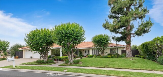 1162 Castlegate, North Tustin, CA 92705 - view of front of house with a tiled roof, driveway, a front lawn, and stucco siding