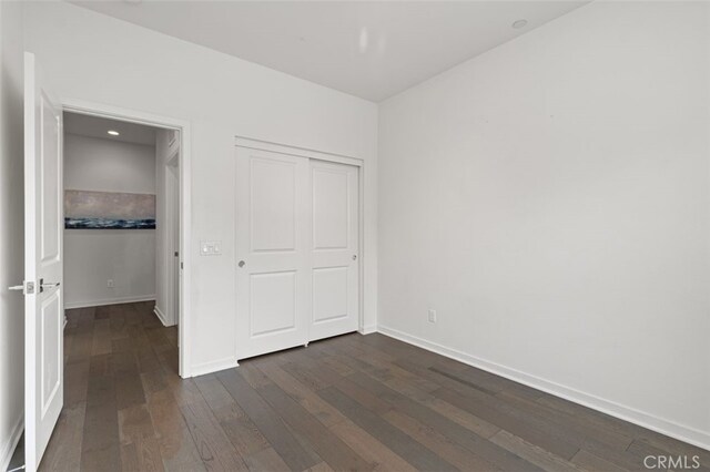 78 Patria, Rancho Mission Viejo, CA 92694 - unfurnished bedroom with dark wood-style floors and a closet