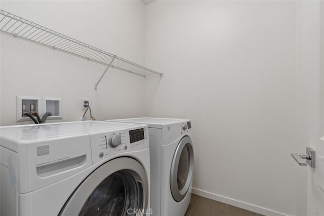 78 Patria, Rancho Mission Viejo, CA 92694 - laundry area featuring washing machine and dryer and dark wood-type flooring