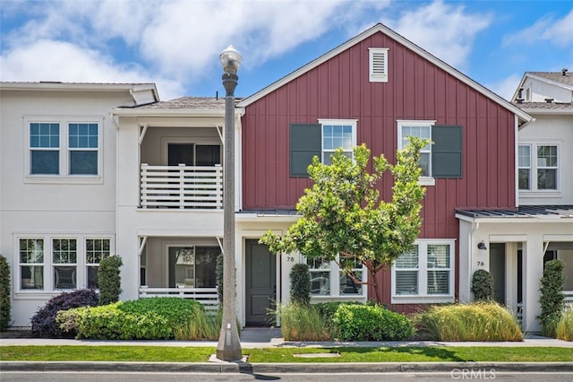 78 Patria, Rancho Mission Viejo, CA 92694 - townhome / multi-family property with board and batten siding, a metal roof, and a standing seam roof