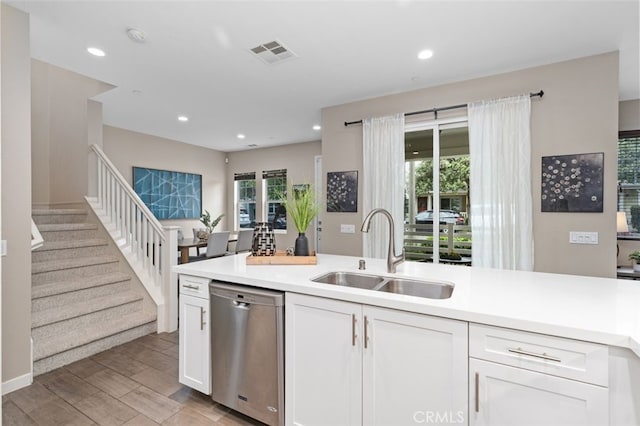 78 Patria, Rancho Mission Viejo, CA 92694 - kitchen featuring dishwasher, white cabinets, light countertops, recessed lighting, and light wood finished floors