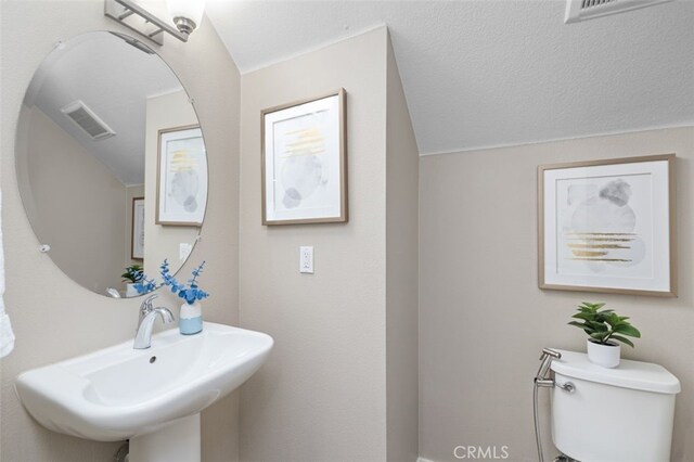 78 Patria, Rancho Mission Viejo, CA 92694 - bathroom featuring toilet and vaulted ceiling