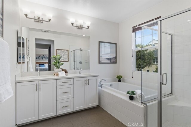 78 Patria, Rancho Mission Viejo, CA 92694 - full bathroom featuring a shower stall, a garden tub, and double vanity