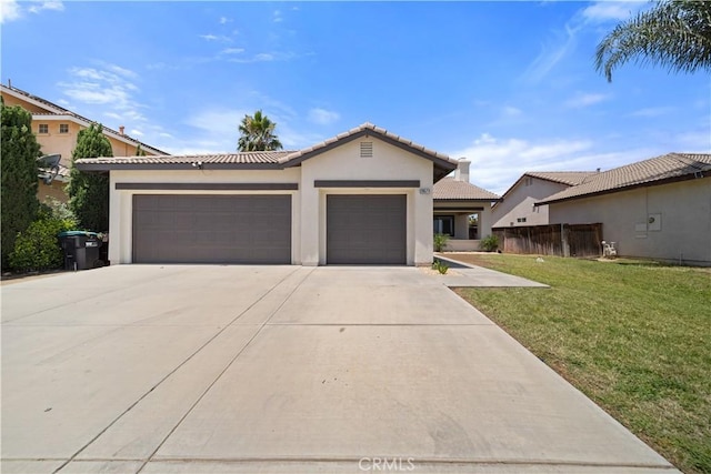 26577 Trumble Rd, Menifee, CA 92585 - view of front of home featuring a garage, stucco siding, a tile roof, and driveway