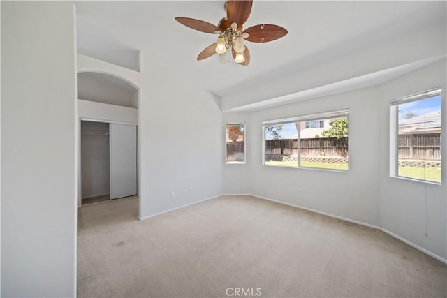 26577 Trumble Rd, Menifee, CA 92585 - unfurnished room with carpet, plenty of natural light, a ceiling fan, and lofted ceiling