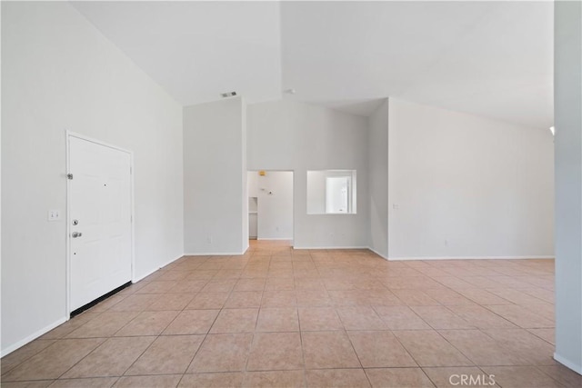 26577 Trumble Rd, Menifee, CA 92585 - spare room featuring light tile patterned floors and high vaulted ceiling