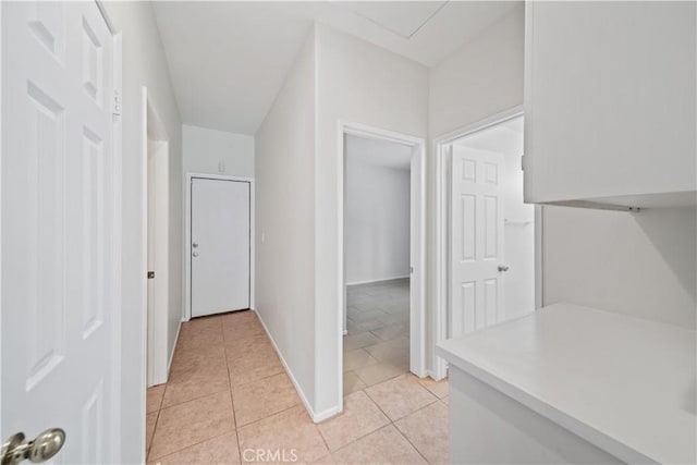 26577 Trumble Rd, Menifee, CA 92585 - hallway with light tile patterned floors and baseboards