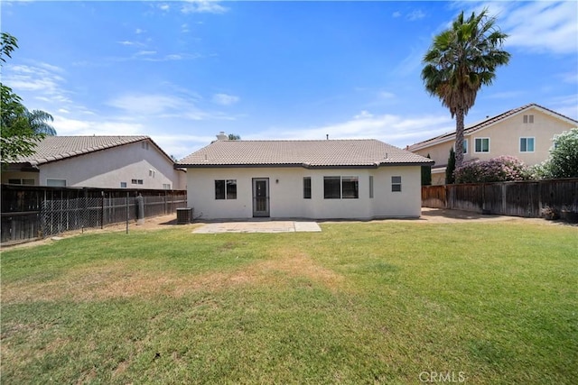 26577 Trumble Rd, Menifee, CA 92585 - rear view of house with a fenced backyard, a patio, stucco siding, a tile roof, and a chimney