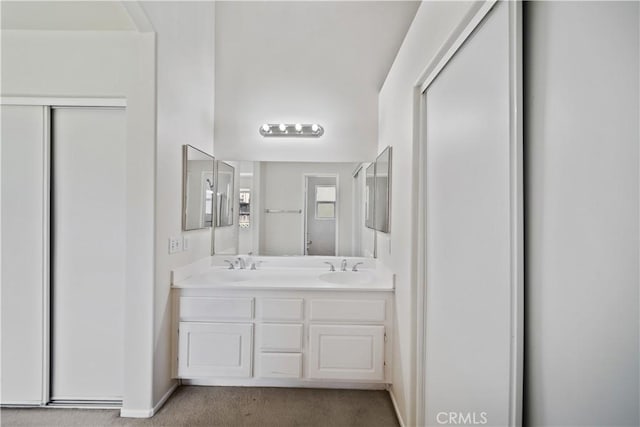 26577 Trumble Rd, Menifee, CA 92585 - bathroom featuring double vanity and baseboards