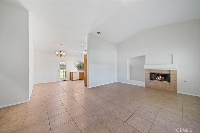 26577 Trumble Rd, Menifee, CA 92585 - unfurnished living room with a chandelier, light tile patterned floors, a tile fireplace, lofted ceiling, and recessed lighting